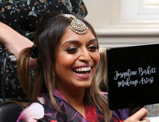 Bride having her make up done