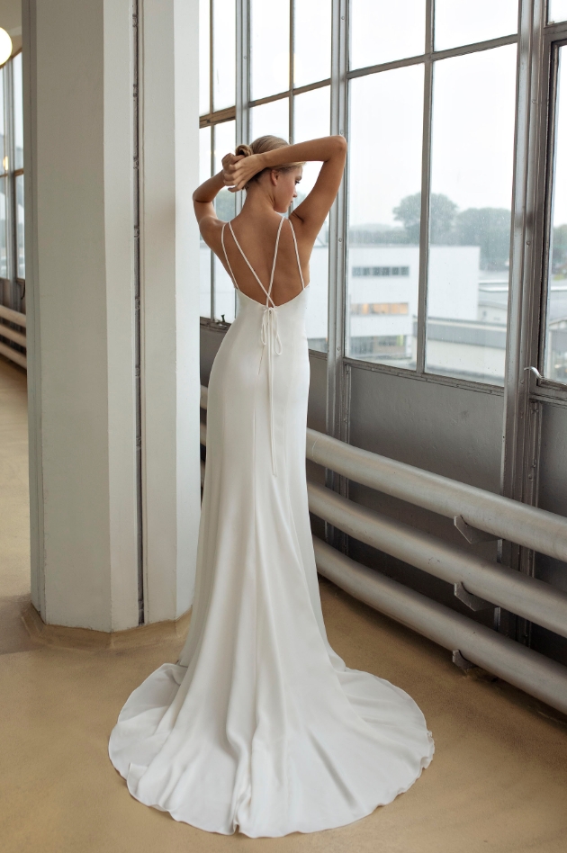 Back shot of model wearing wedding dress with thin spaghetti straps