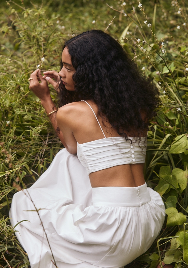 Model wearing a two-piece bridal outfit