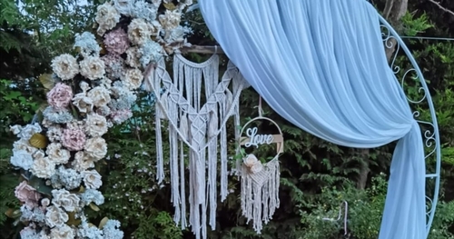 moongate with drapes, hanging macrame and flowers