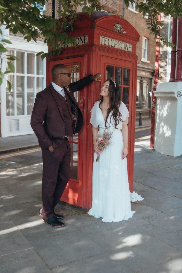 Couple in front of telephone box