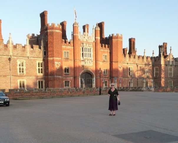 Janet Shell standing in front of a wedding venue