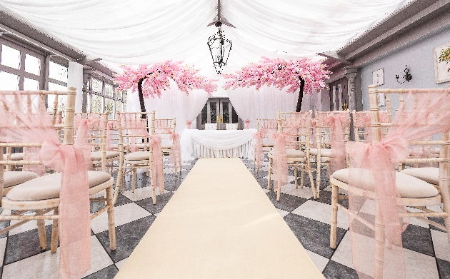 Indoor ceremony setup at Stanhill Court