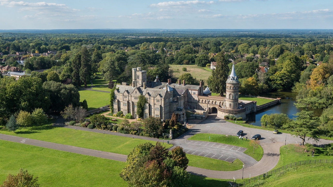 historic towers with pond and surrounding grounds and countryside