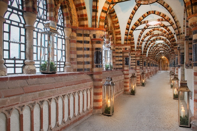 Historical cloisters with stone walls and paned windows