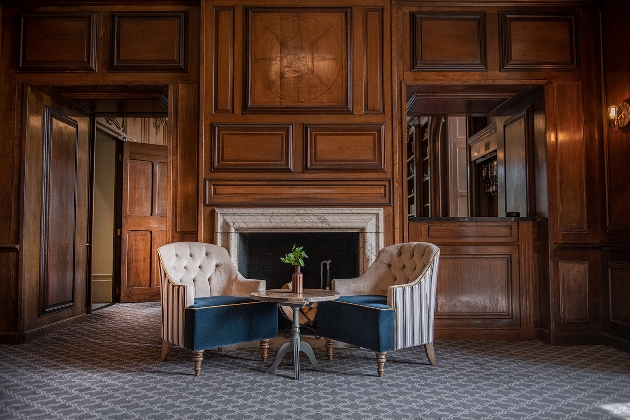 oak panelled bar with two chairs