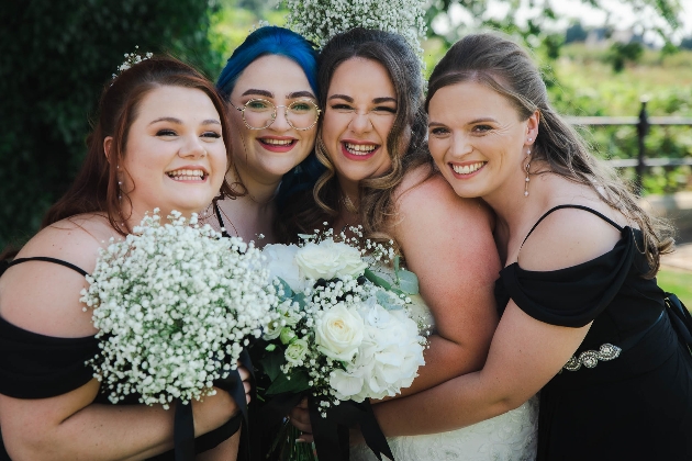 bride and bridesmaids in black dresses