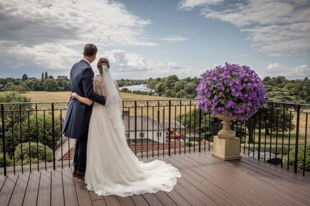 Married couple looking out over The Petersham Hotel balcony