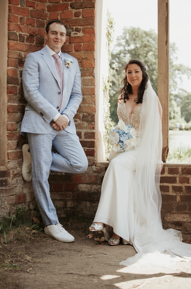 Couple pose by window