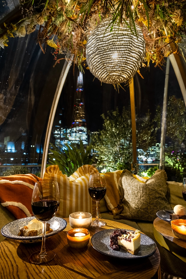 hanging flower display, chandelier, tables wine 