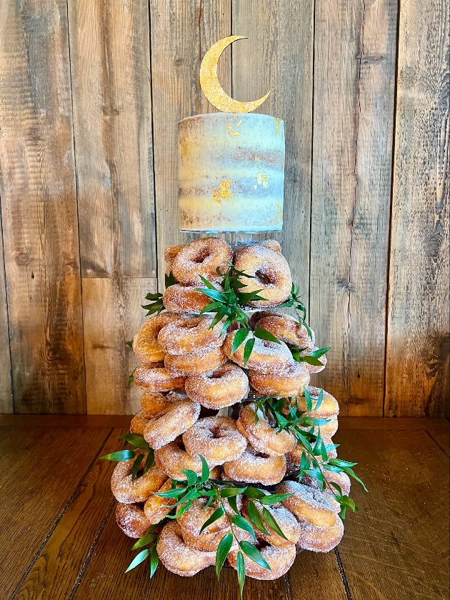 Doughnut tower with a cake on the top