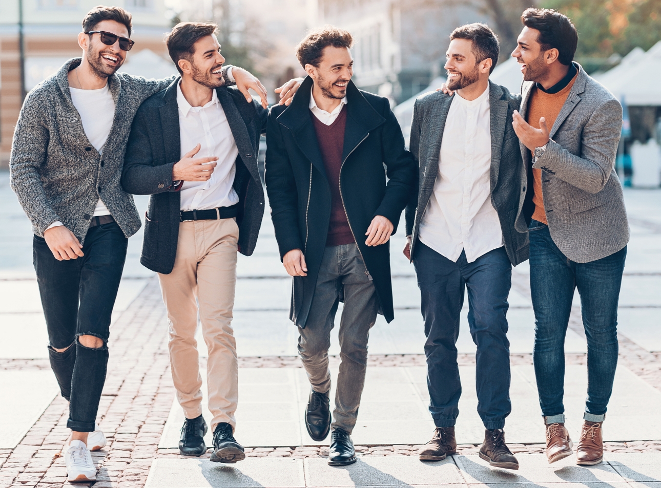 group of men walking down road