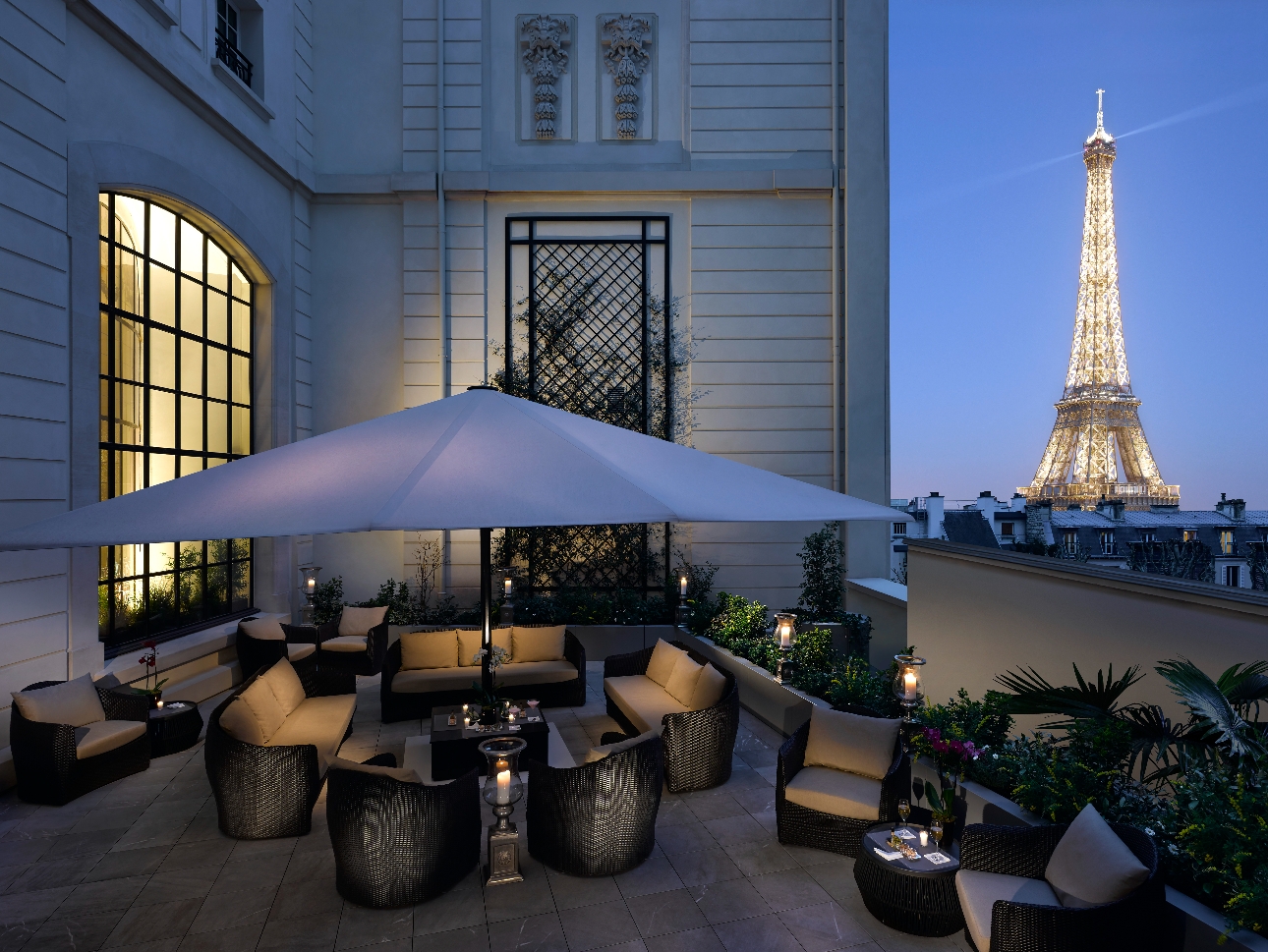 seating on terrace, at night, view of the Eiffel Tower