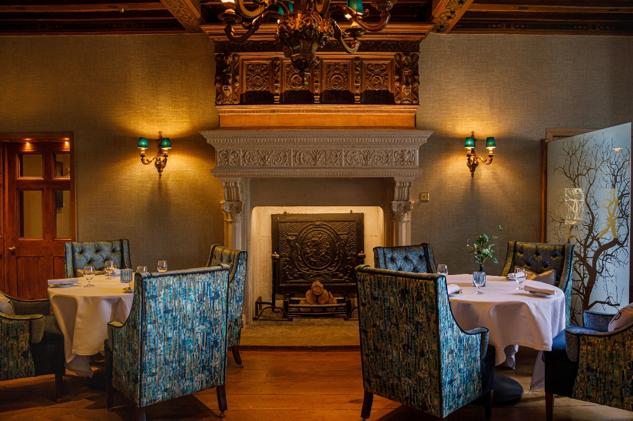 interior of historic room with opulent chairs and wood tables