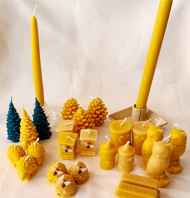 range of yellow wax products different styles of candles and wax melts