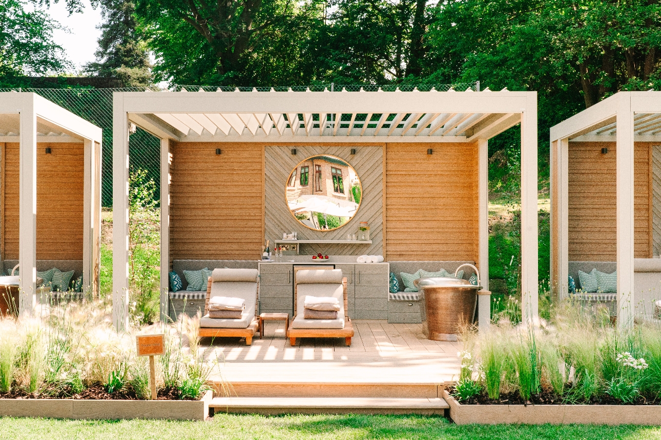 wooden gazebo with bath tub, treatment beds, seating areas