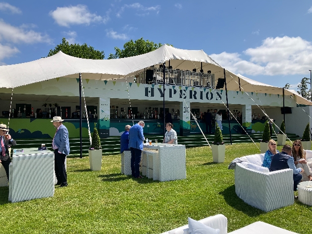 outdoor seating area and a grandstand with a tent style roof