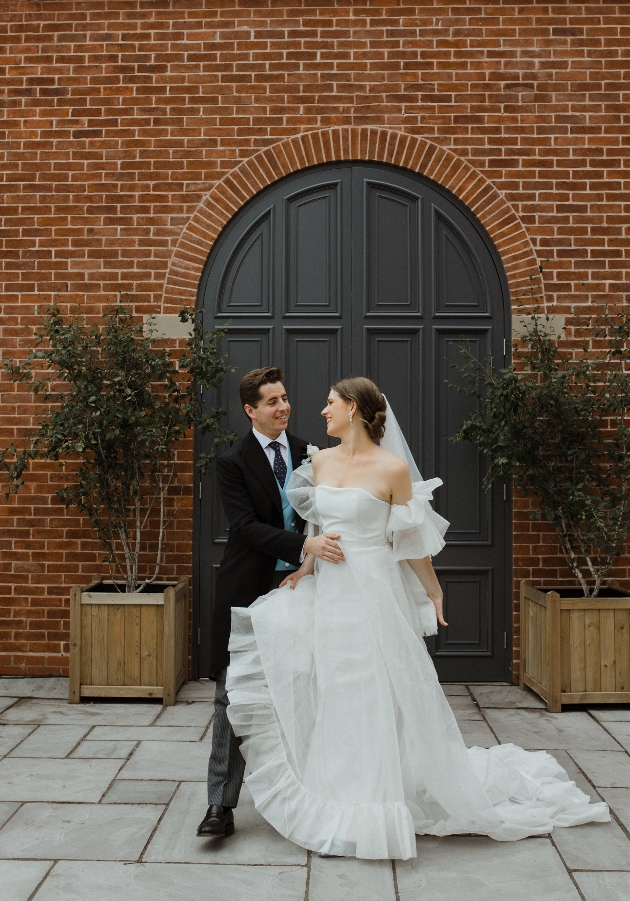 A bride and groom embracing