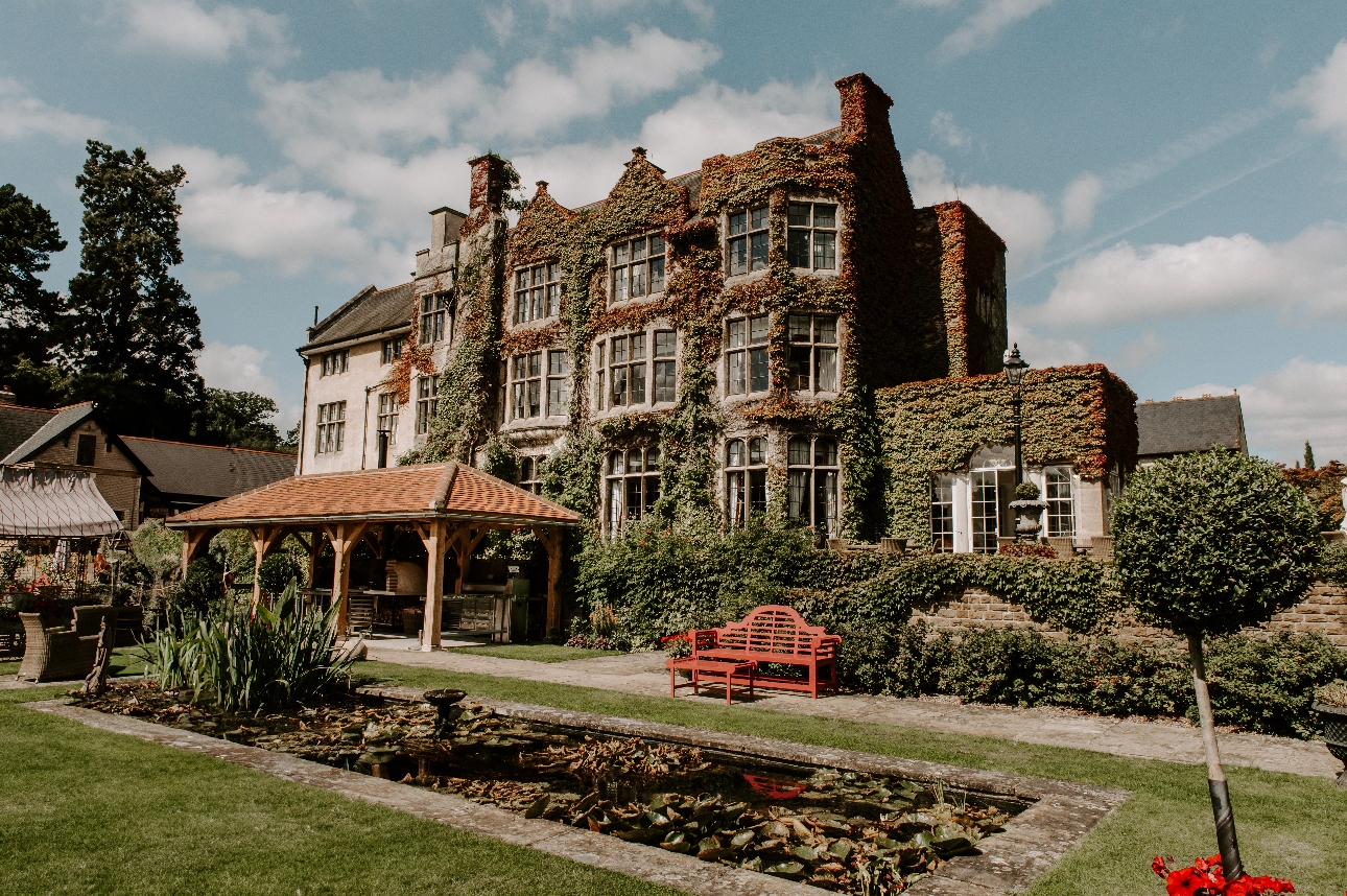 Pennyhill Park exterior historic manor house covered in ivy