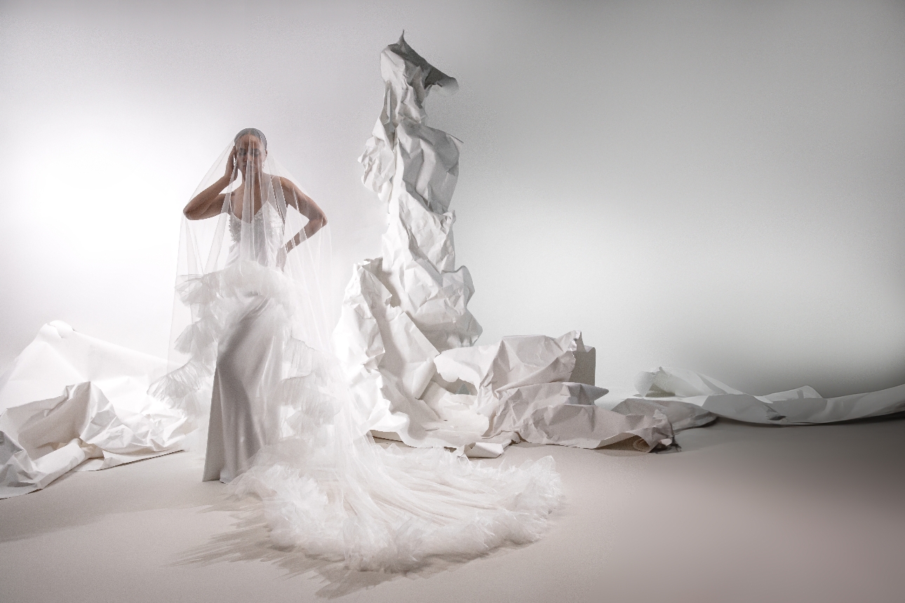 model in silk dress with ruffled floor-length veil 