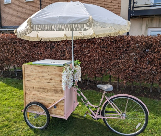 pink ice cream trike with parasol 