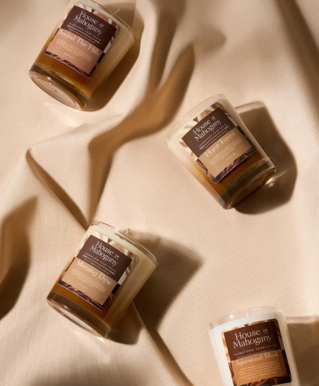 candles laid on beige satin