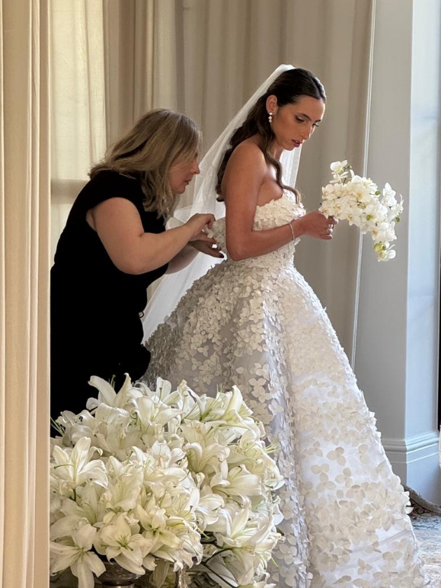 Bride being helped into her dress