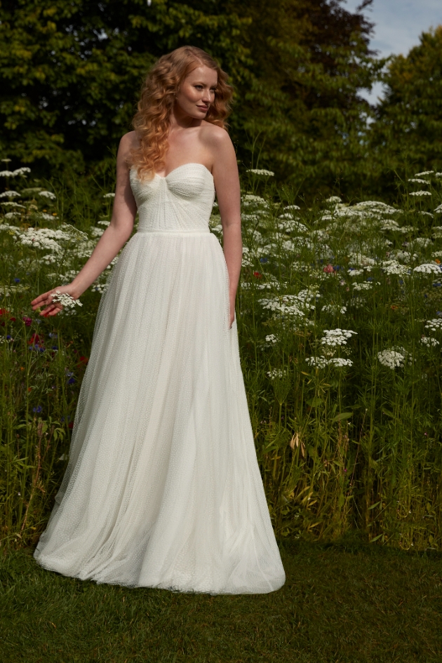 woman posing in wildflower field