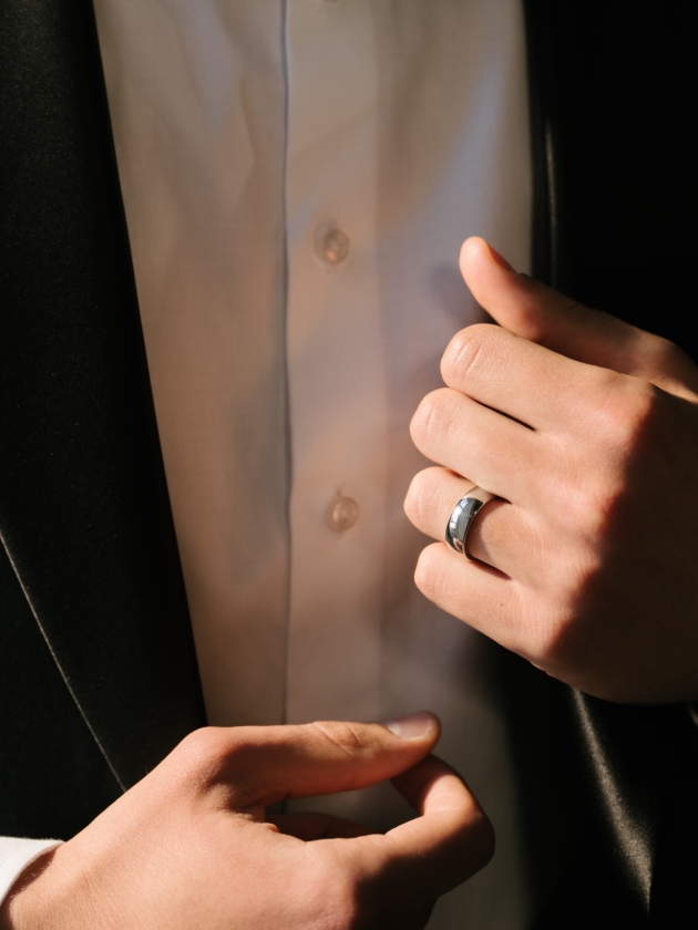 man wearing tux and silver wedding band 