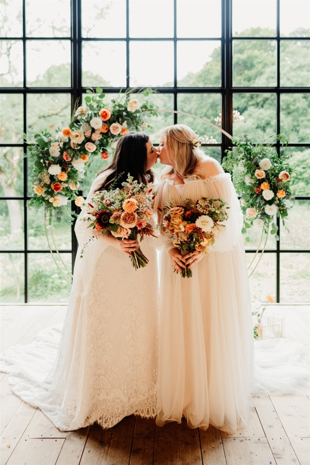 two brides in wedding dresses