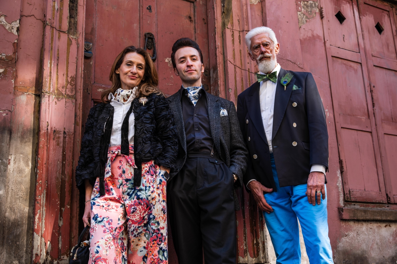 three models in varying styles of clothes and colours with accessories